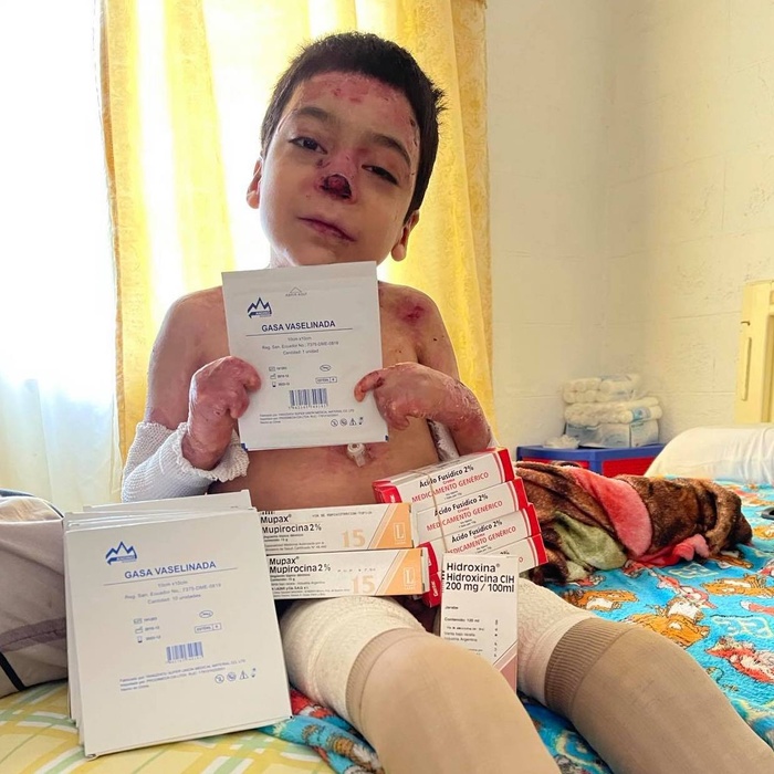 Jesus sitting with medical supplies for wound care